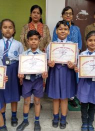 Students display their dancing & singing competition certificates